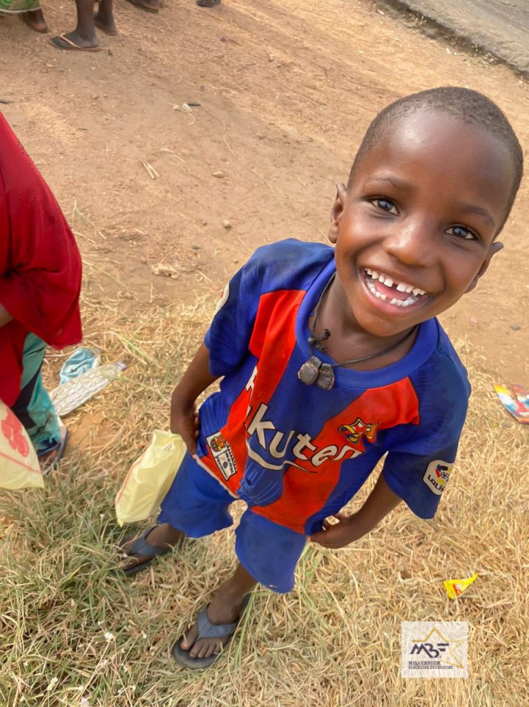 happy street child after being fed by mbfghana